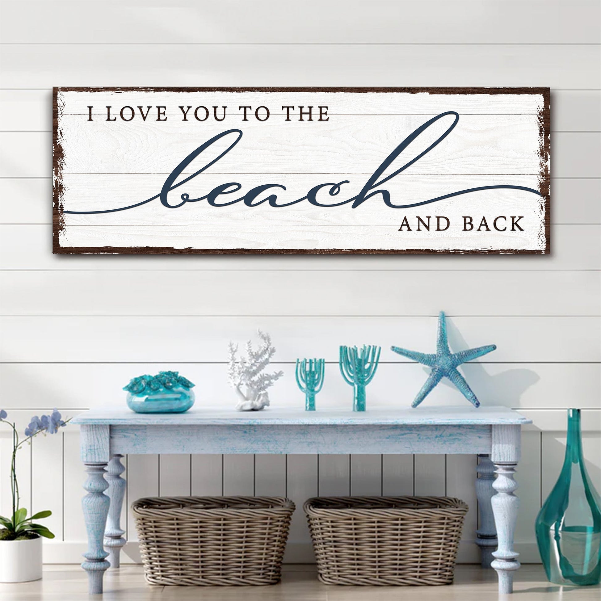 Canvas sign I LOVE YOU TO THE BEACH AND BACK with blue script beach on distressed white wood frame on Tampa Home & Garden Store