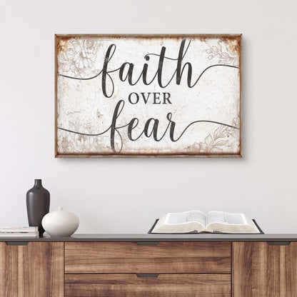 Faith Over Fear canvas sign; rustic wood frame, distressed white panel with floral accents on Tampa Home & Garden Store