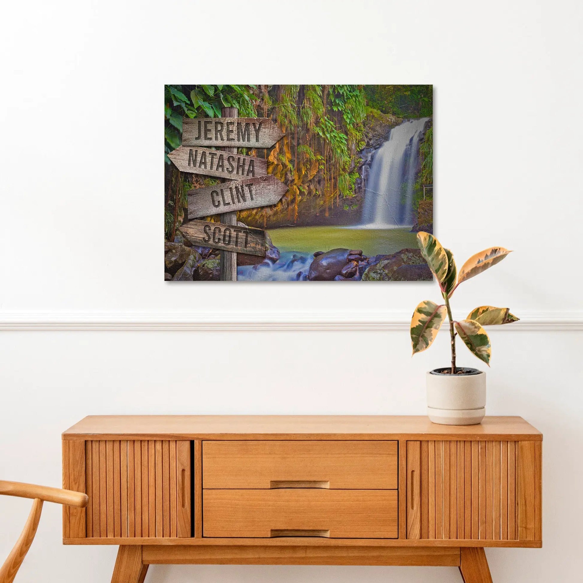 Waterfall Family Names Sign canvas print with rustic signposts beside a lush waterfall on Tampa Home & Garden Store