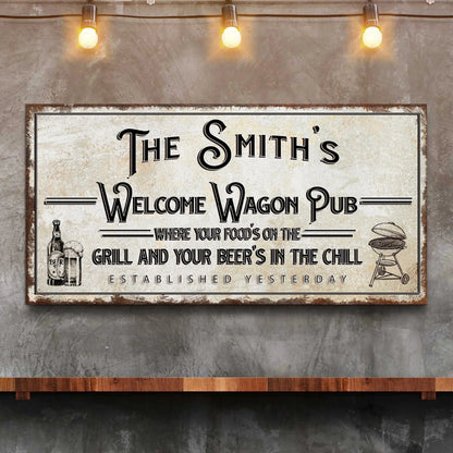 Canvas sign The Smith's Welcome Wagon Pub with distressed frame and warm string lights on Tampa Home & Garden Store