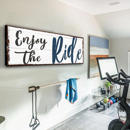 Canvas wall art Enjoy The Ride sign by Tailored Canvases; distressed white wood panel with bold blue Ride text on Tampa Home & Garden Store