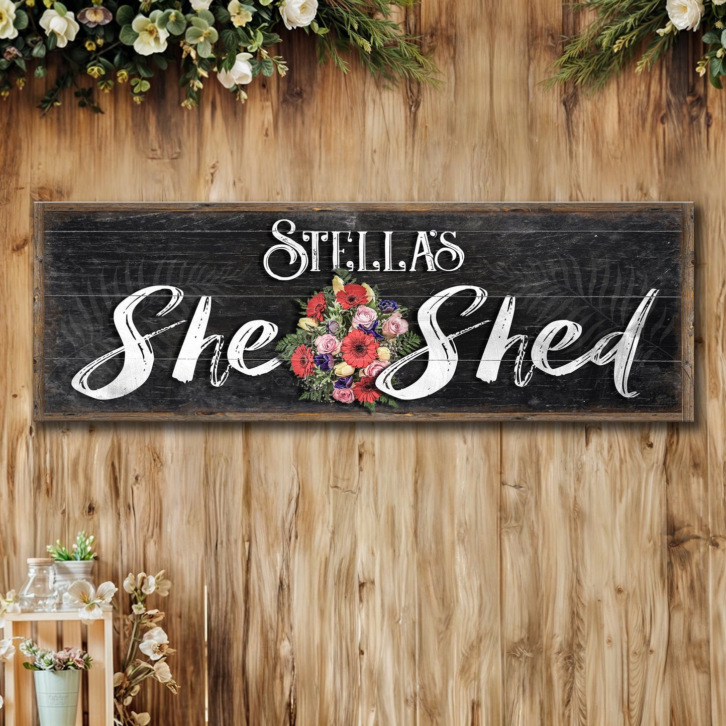 Personalized She Shed Sign canvas with white script and floral bouquet on rustic chalkboard on Tampa Home & Garden Store