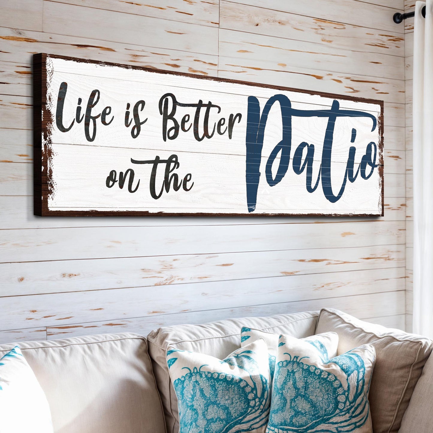 Canvas sign Life Is Better On The Patio by Tailored Canvases; blue Patio lettering on Tampa Home & Garden Store
