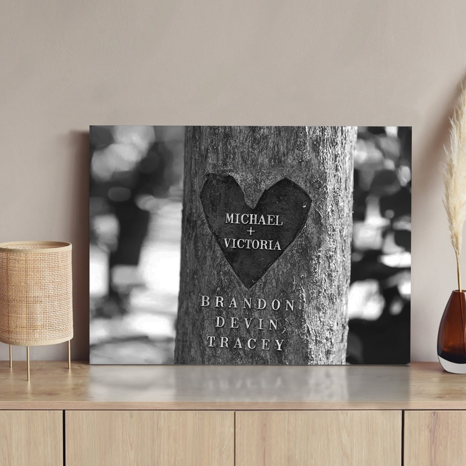 Tree Trunk Family Names Sign canvas by Tailored Canvases, black-and-white close-up of carved names on Tampa Home & Garden Store