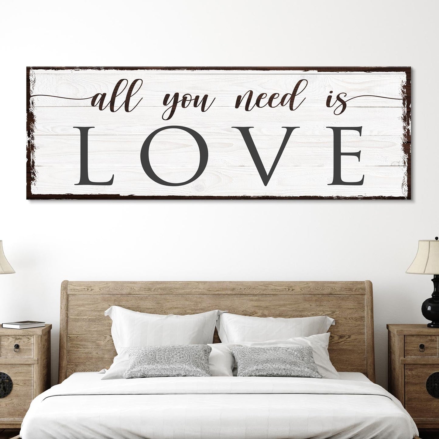 All You Need Is Love canvas sign with whitewashed wood background and distressed frame on Tampa Home & Garden Store