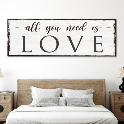 All You Need Is Love canvas sign with whitewashed wood background and distressed frame on Tampa Home & Garden Store