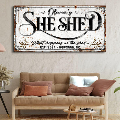 Personalized She Shed Sign XVIII canvas featuring Olivia's script and bold SHE SHED text on distressed white backdrop on Tampa Home & Garden Store