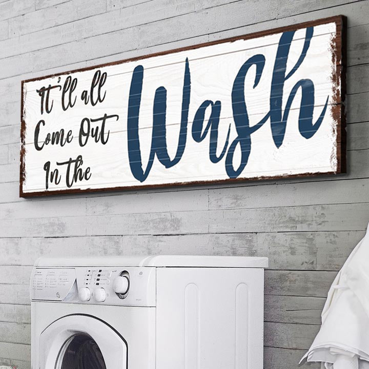 Tailored Canvases canvas sign It’ll All Come Out In The Wash with blue lettering above a washer on Tampa Home & Garden Store