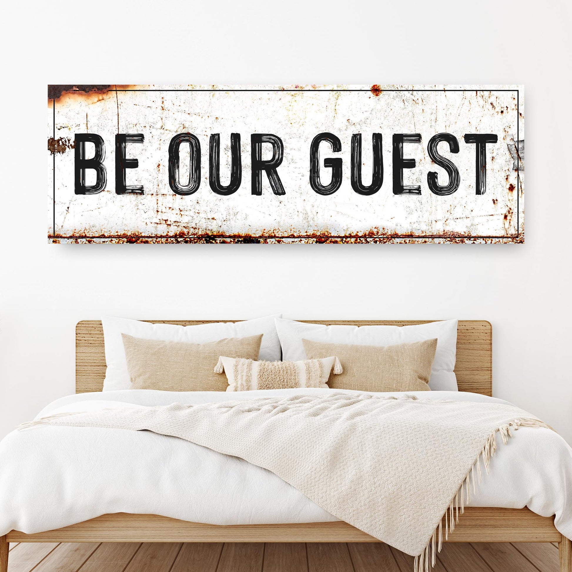 Be Our Guest Sign V canvas with rustic white weathered surface above bed on Tampa Home & Garden Store