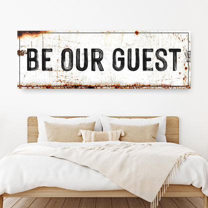 Be Our Guest Sign V canvas with rustic white weathered surface above bed on Tampa Home & Garden Store