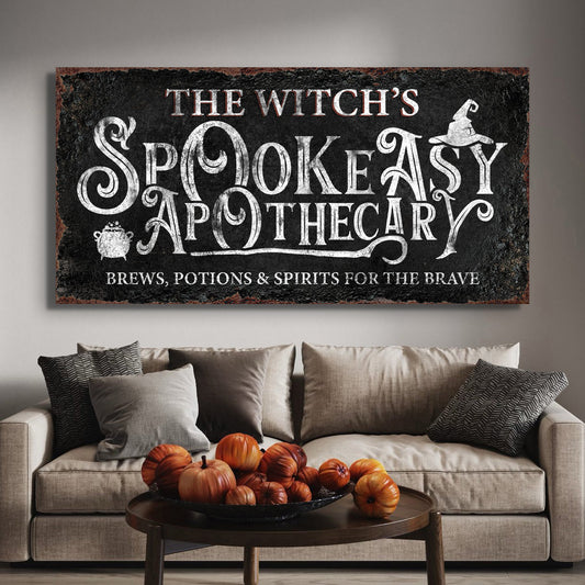 Canvas sign The Witch's Spookeasy Apothecary with white chalk lettering witch hat cauldron on Tampa Home & Garden Store