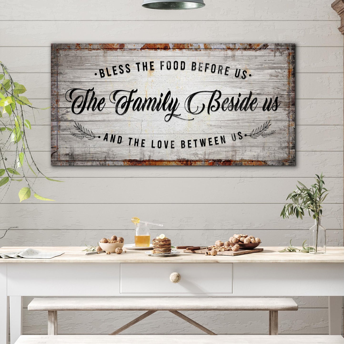 Bless The Food Before Us canvas sign with rustic weathered wood, black script typography on Tampa Home & Garden Store