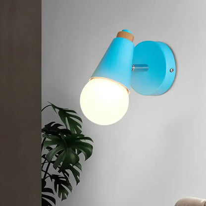 Blue cone wall sconce with frosted globe bulb on Tampa Home & Garden Store