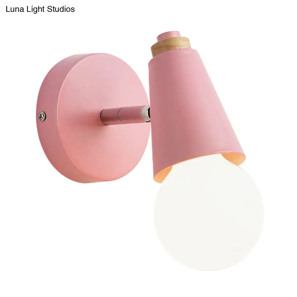 Pink cone wall sconce by Decorbites with round backplate and angled shade wall-mounted on Tampa Home & Garden Store