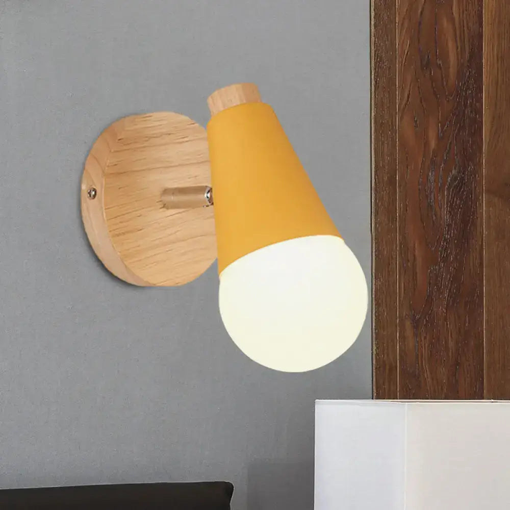Pink cone wall sconce by Decorbites with wooden mount and warm orange shade on Tampa Home & Garden Store