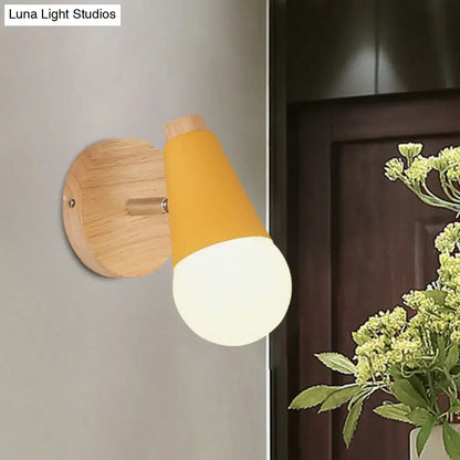 Decorbites cone wall sconce with mustard yellow shade and natural wood backplate on Tampa Home & Garden Store