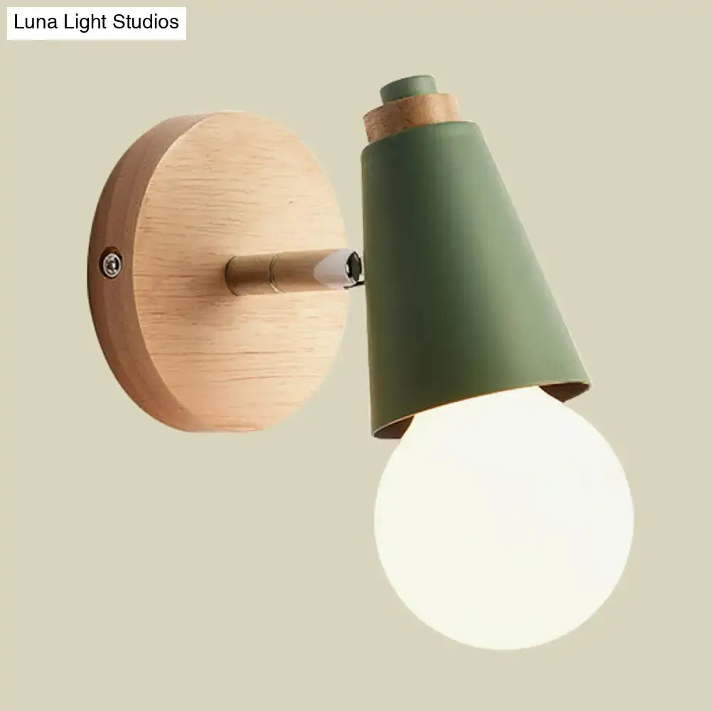 Pink Cone Wall Sconce with green metal shade and natural wood backplate, warm globe bulb on Tampa Home & Garden Store