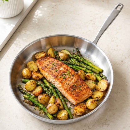 5-Ply Stainless Steel Frying Pan with herb-seasoned salmon, potatoes and asparagus on Tampa Home & Garden Store