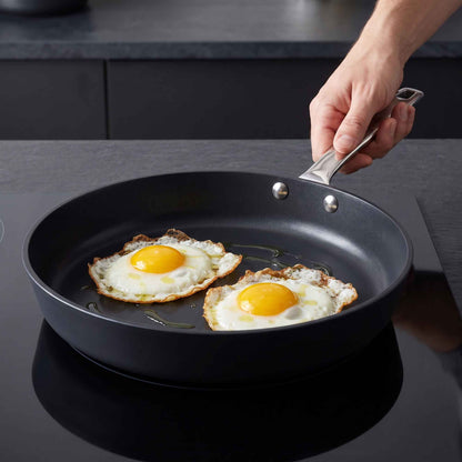 Ceramic Nonstick Frying Pan by Alva Cookware; black interior with sunny eggs on Tampa Home & Garden Store