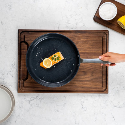 Ceramic Nonstick Frying Pan by Alva Cookware on wood board with salmon and lemon slices on Tampa Home & Garden Store