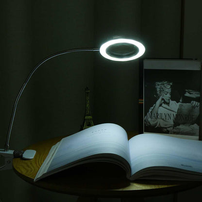 Stevvex magnifier ring LED USB desk lamp with flexible gooseneck over an open book on Tampa Home & Garden Store