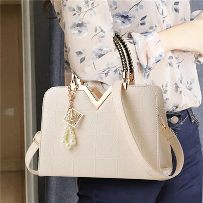 Stevvex ivory leather satchel with geometric quilt pattern, studded handle, phone pocket on Tampa Home & Garden Store