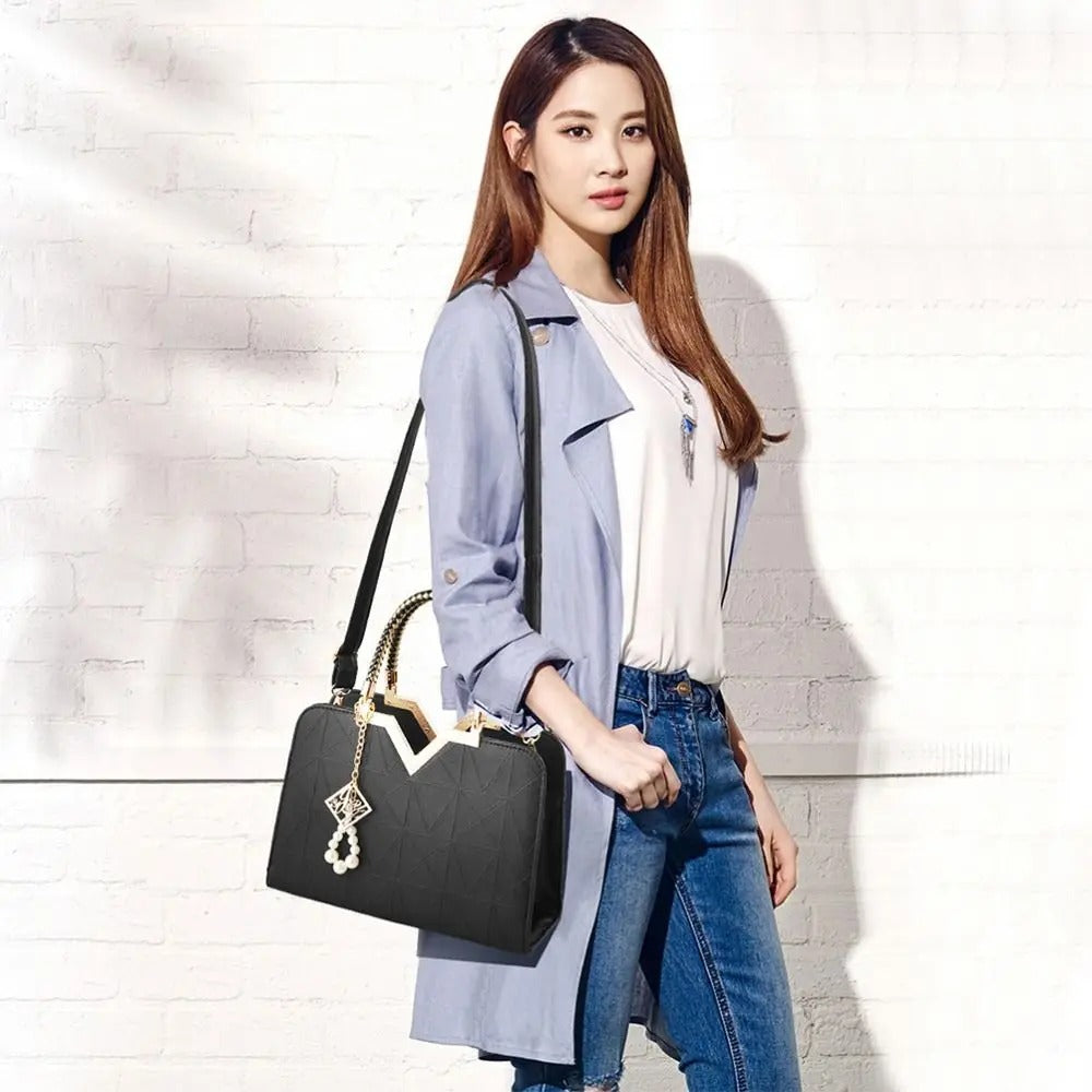 Leather satchel bag Stevvex in black with quilted panels, top handle and gold-tone hardware on Tampa Home & Garden Store