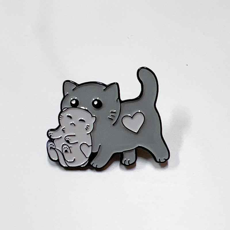 Mama Cat carrying kitten enamel pin, gray cat brooch by Shaketea for cat lovers on Tampa Home & Garden Store