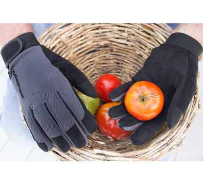 Manswork Performance Gloves in gray and black, holding fresh tomatoes in a wicker basket on Tampa Home & Garden Store