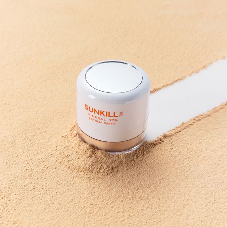 MAXCLINIC Sunkill Mineral UV Sun Powder compact with white lid and orange SUNKILL label on sand on Tampa Home & Garden Store