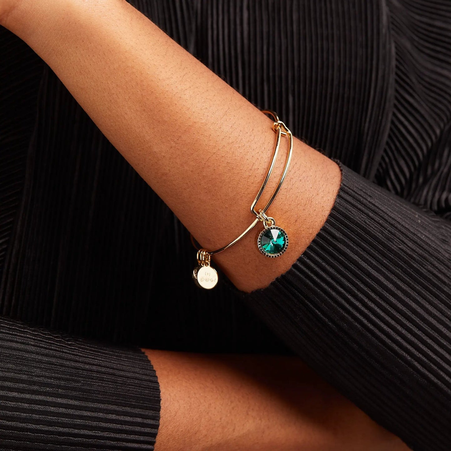 May Birthstone Emerald charm bracelet on a gold-tone bangle with green gemstone on wrist on Tampa Home & Garden Store