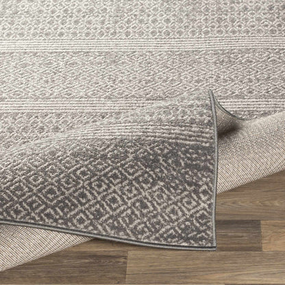 Mckinney Area Rug - Clearance by Boutique Rugs in gray textured pattern on hardwood floor on Tampa Home & Garden Store