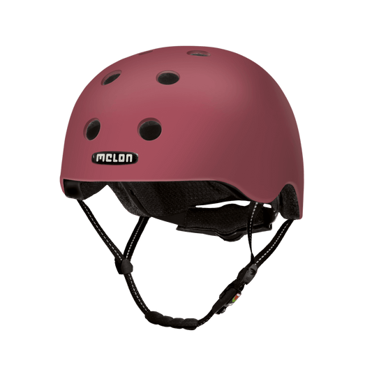 Paris bicycle helmet rosy pink with vent holes; Melon Helmets USA logo visible on shell on Tampa Home & Garden Store