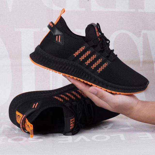 Stevvex Men Breathable Mesh Sneakers black with orange outsole, lace-up lightweight running trainers on Tampa Home & Garden Store