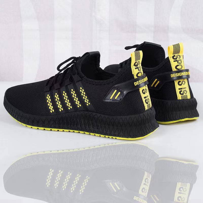 Men's Stevvex black mesh sneakers pair with yellow pull tabs lace-up on Tampa Home & Garden Store