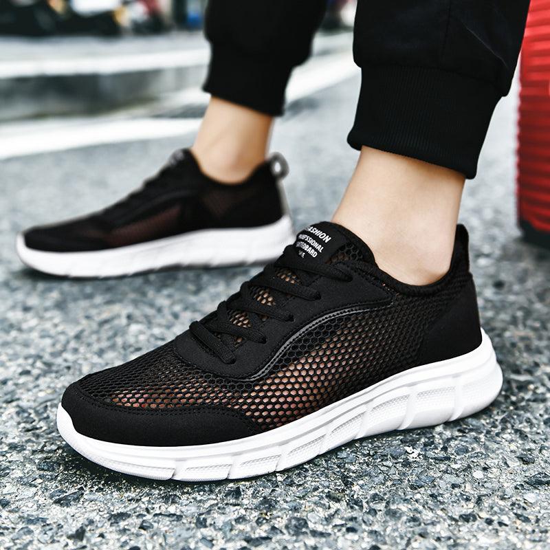 Stevvex men's black mesh sneakers, breathable upper and white chunky sole, pair shown on Tampa Home & Garden Store