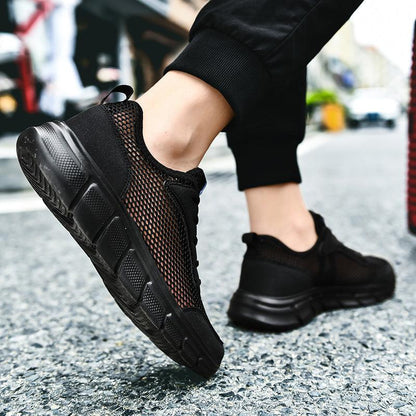 Men's black mesh sneakers Stevvex breathable athletic running shoes on city street on Tampa Home & Garden Store