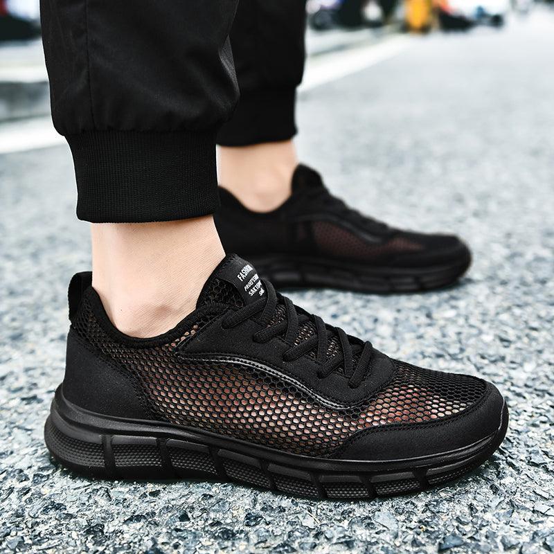 Stevvex men's black mesh sneakers with breathable upper and chunky cushioned sole on street on Tampa Home & Garden Store