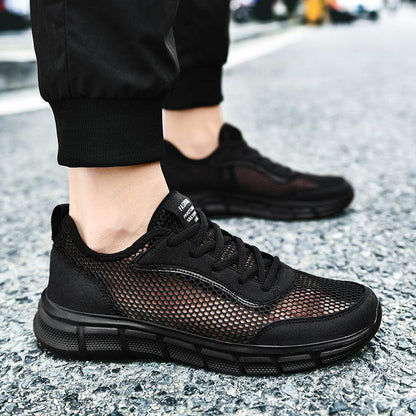 Stevvex men's black mesh sneakers with breathable upper and chunky cushioned sole on street on Tampa Home & Garden Store