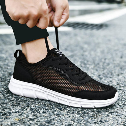 Stevvex men's casual black mesh sneakers with breathable upper and white sole on Tampa Home & Garden Store