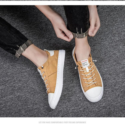 Stevvex tan canvas sneakers lace-up pair with white toe caps and soles on gray carpet on Tampa Home & Garden Store