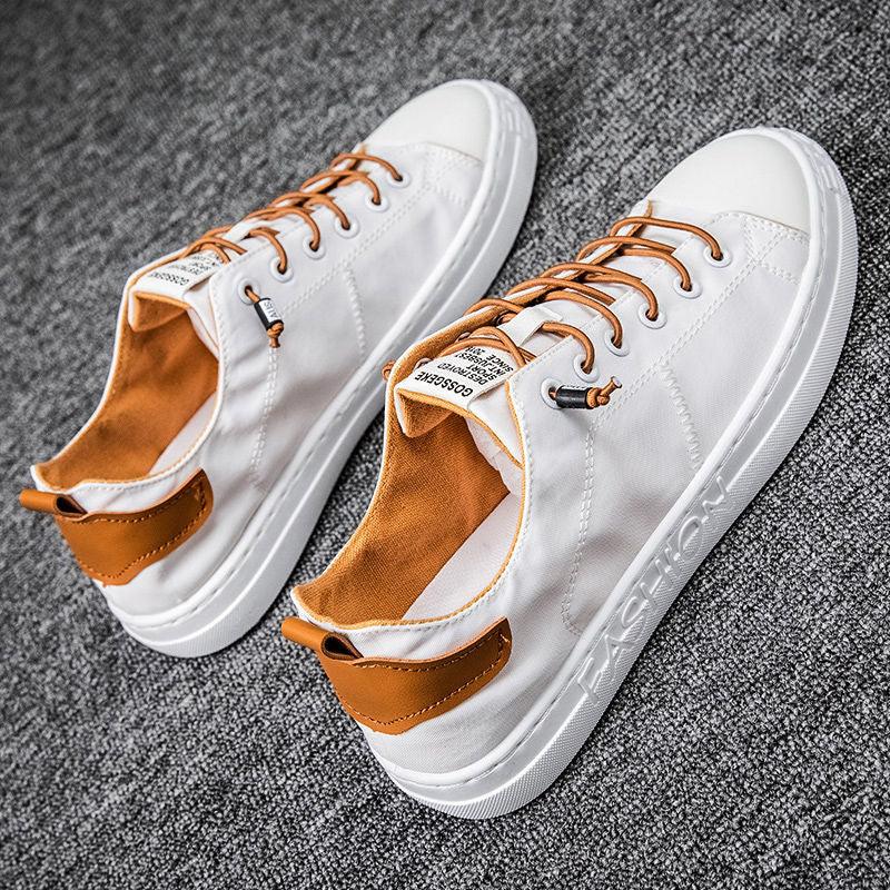 Stevvex white canvas sneakers pair with brown heel tabs, lace-up casual walking shoes on Tampa Home & Garden Store