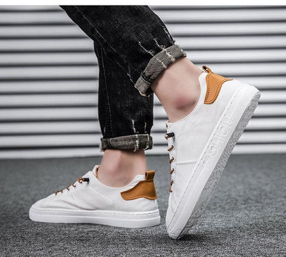 Stevvex white canvas sneakers with tan heel patch, lace-up casual walking shoes on Tampa Home & Garden Store