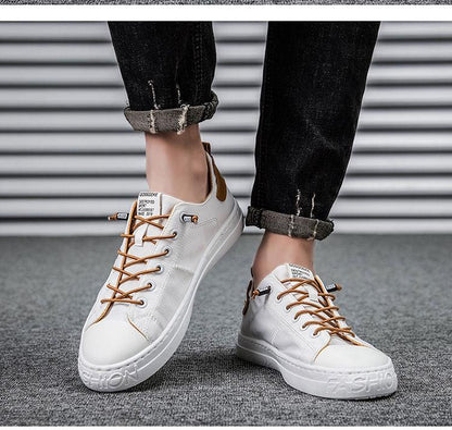 Stevvex men's white canvas sneakers with brown laces, low-top casual walking shoes pair on Tampa Home & Garden Store