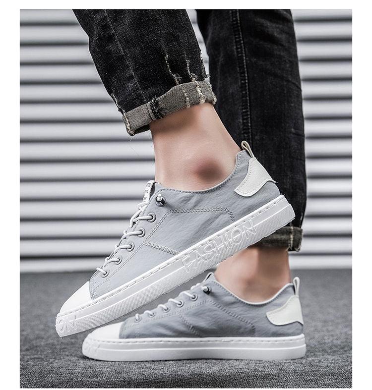 Stevvex grey canvas sneakers lace-up low-top with white sole and embossed text on Tampa Home & Garden Store