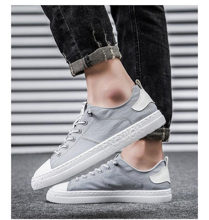Stevvex grey canvas sneakers lace-up low-top with white sole and embossed text on Tampa Home & Garden Store