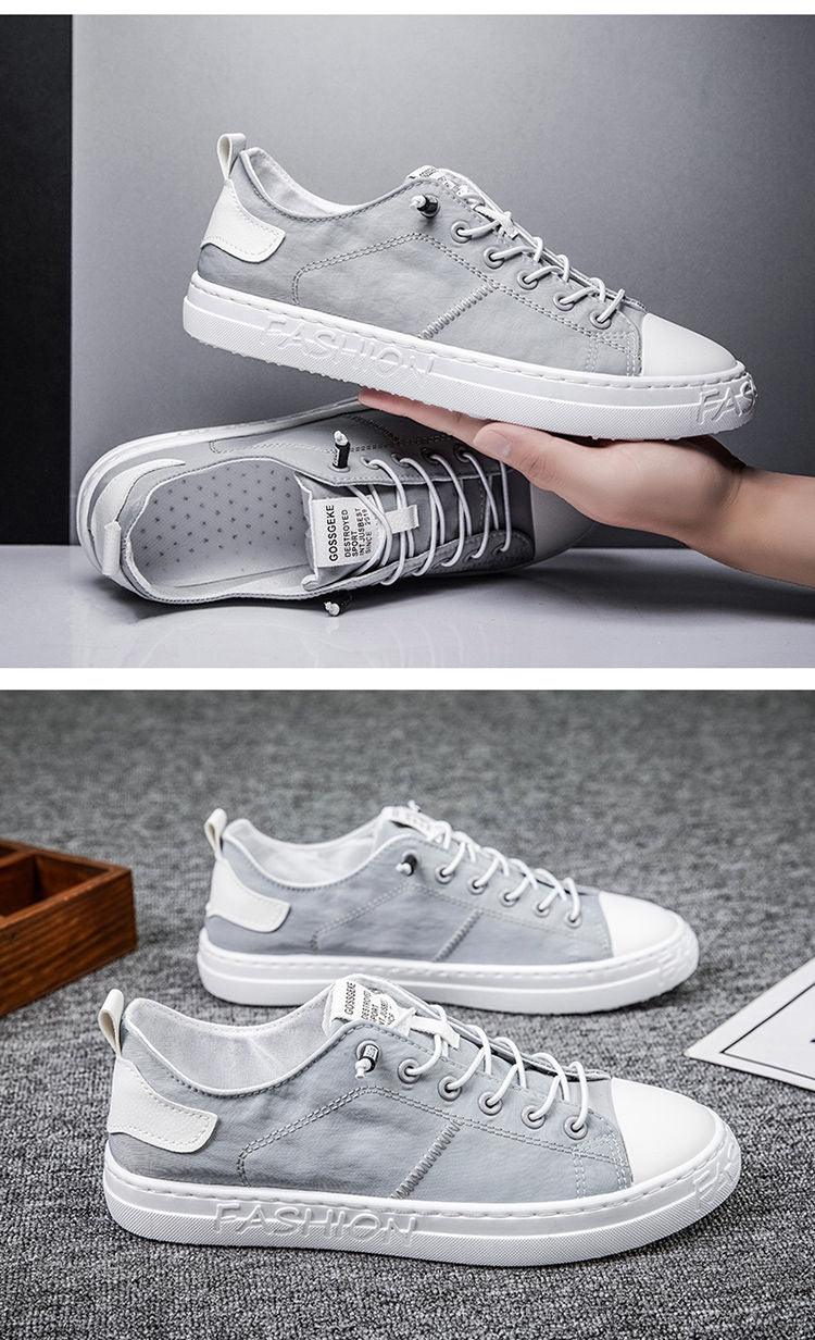 Men's gray canvas sneakers with white toe cap and sole, lace-up casual shoes on Tampa Home & Garden Store
Pair of gray canvas sneakers with white toe caps, lace-up casual walking shoes on Tampa Home & Garden Store