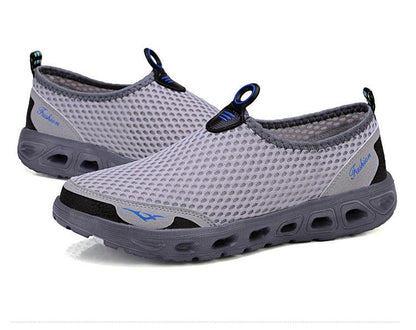 Stevvex men's casual mesh slip-on sneakers with breathable gray upper and perforated sole on Tampa Home & Garden Store