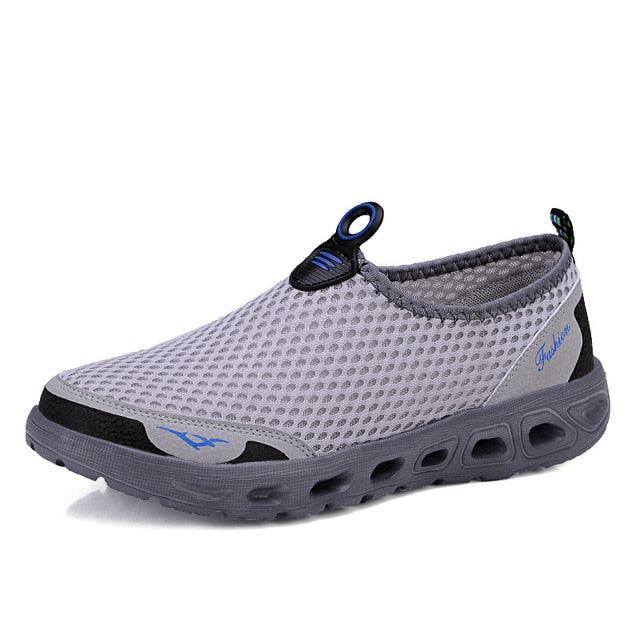 Stevvex men's mesh slip-on sneakers, light gray breathable walking shoes with blue accents on Tampa Home & Garden Store