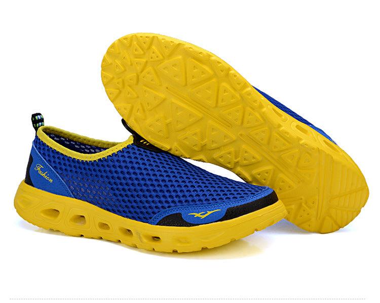 Pair of men's blue mesh sneakers with yellow outsole, breathable slip-on walking shoes on Tampa Home & Garden Store